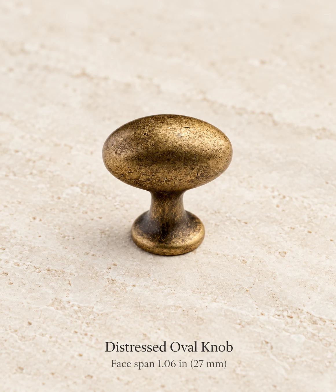 Distressed Oval Knob in antique brass, face span 1.06 in (27 mm)