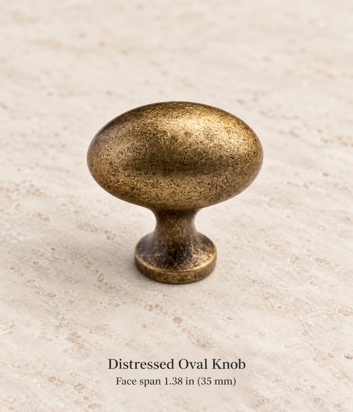Distressed Oval Knob in antique brass, face span 1.38 in (35 mm)