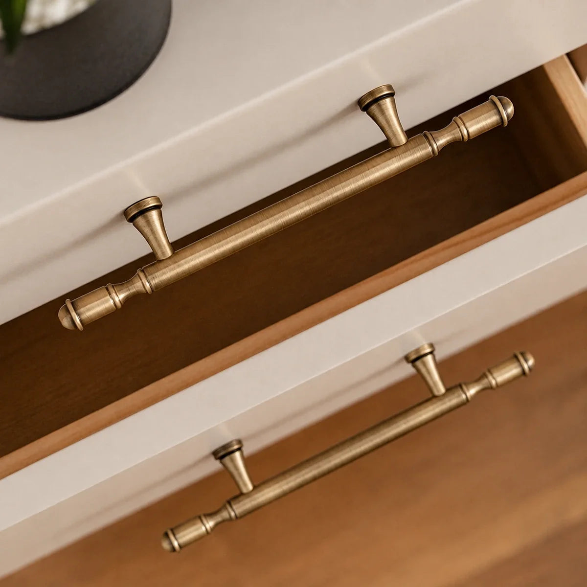 Antique brass ringed cabinet hardware — installed