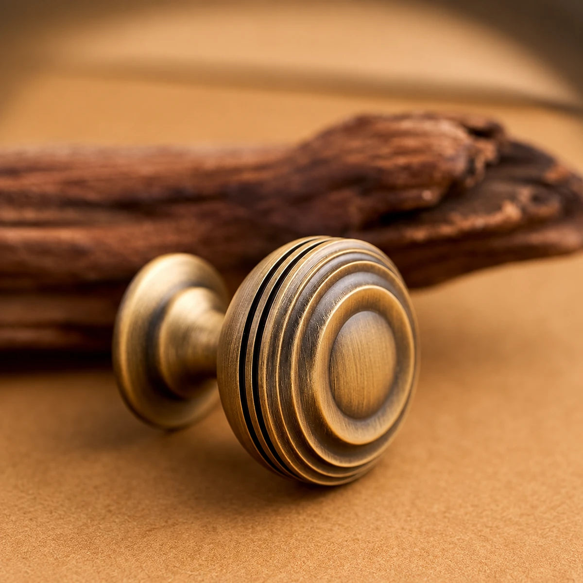 Close-up of the concentric ridges on a brass pedestal cabinet knob