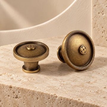 Antique brass rope-rim button cabinet knobs in 1.10 inch and 1.26 inch diameters