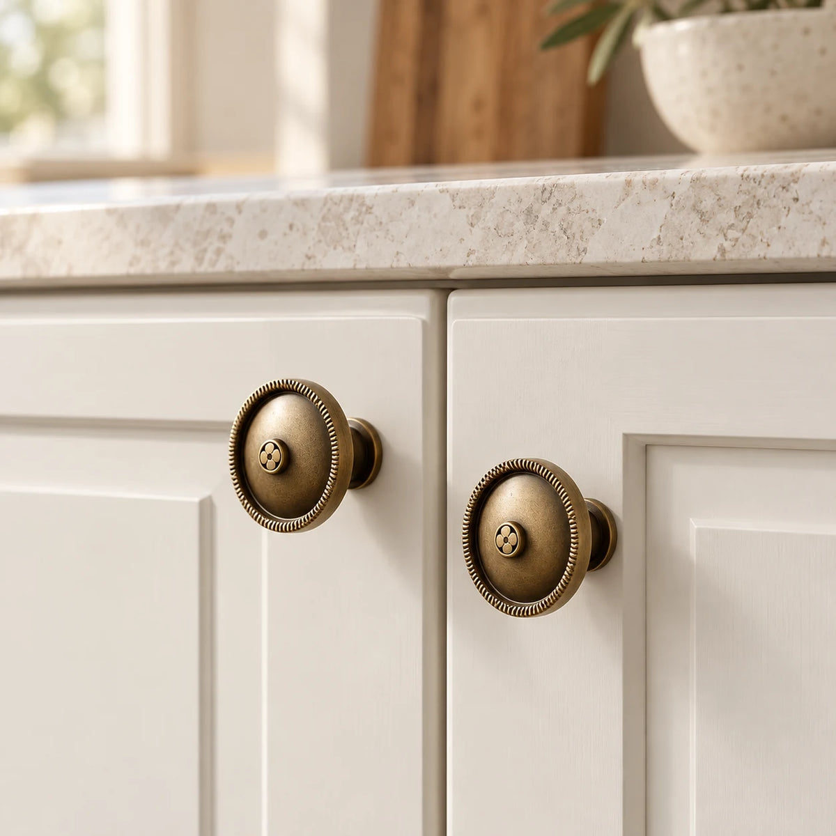 Antique brass rope-rim cabinet knobs installed on premium cabinetry