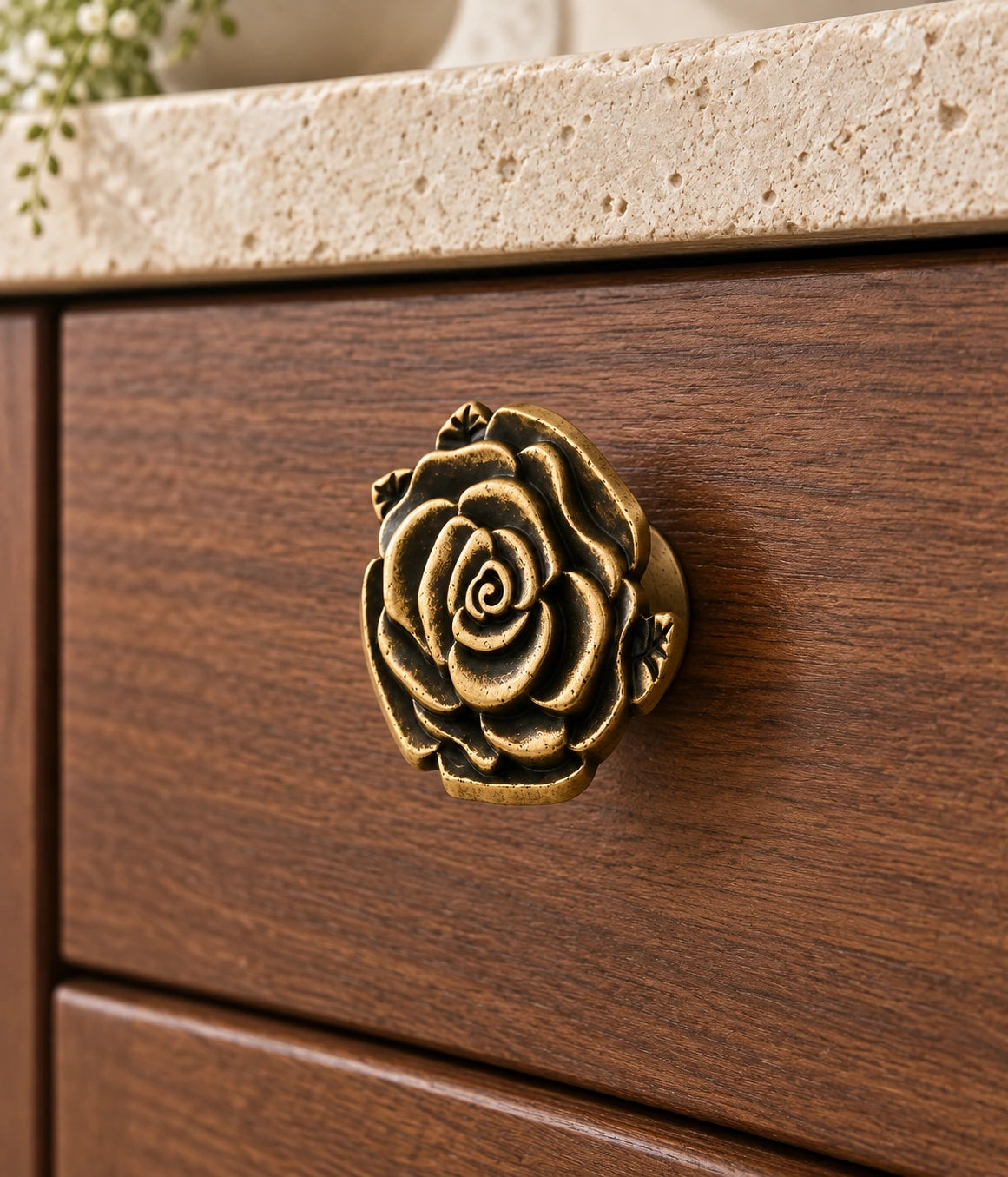 Antique Brass Rose Cabinet Knob installed on a cabinet drawer