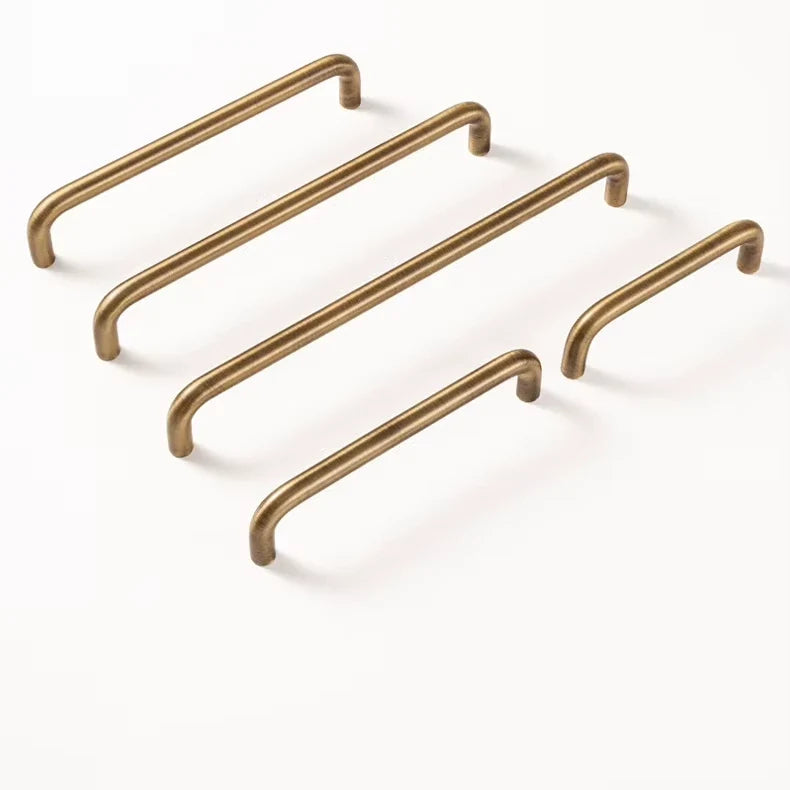 Rounded solid brass cabinet pulls in antique brushed brass