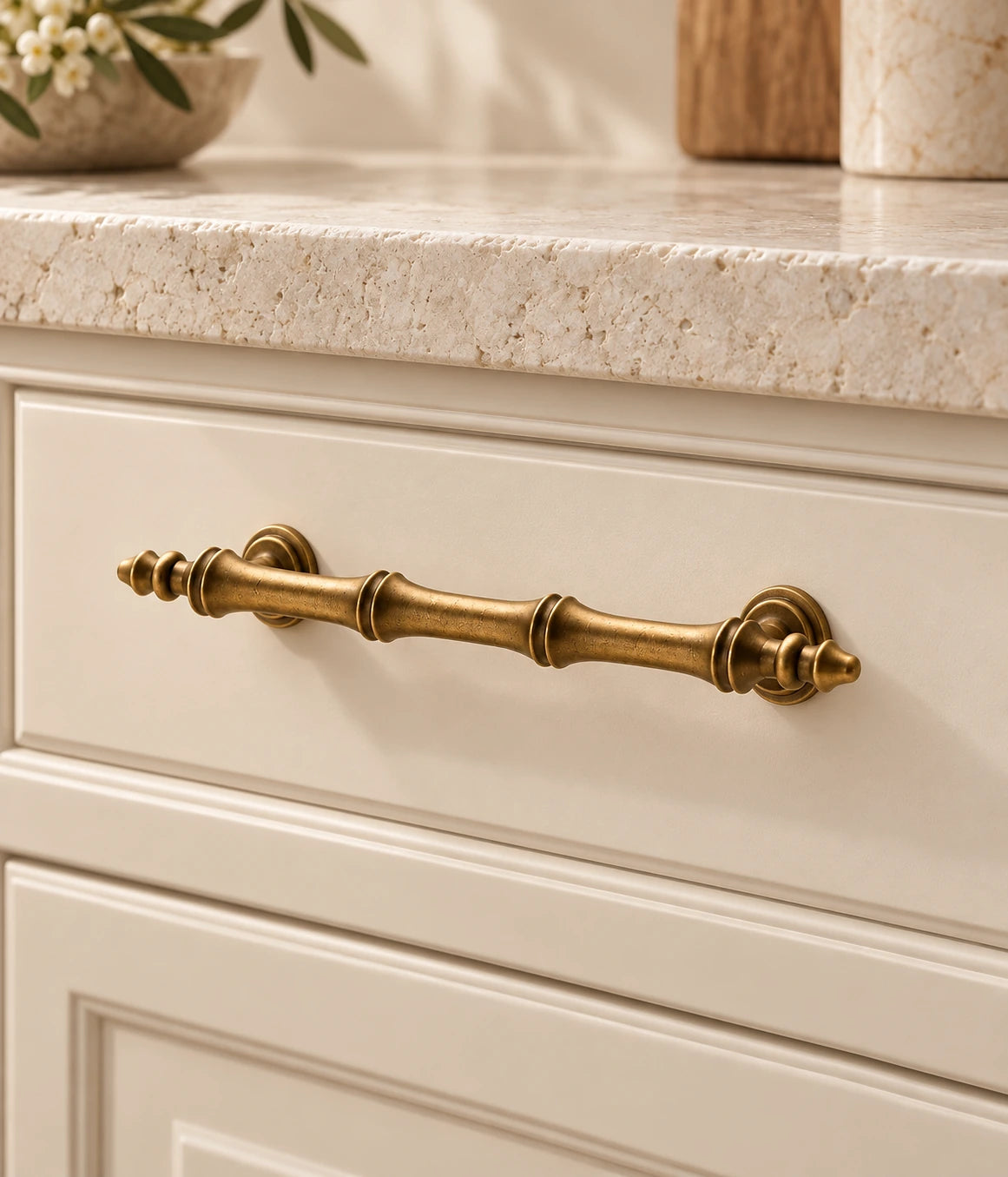 Antique Brass Segmented-Finial Cabinet Pulls & T-Knob installed on a cabinet drawer