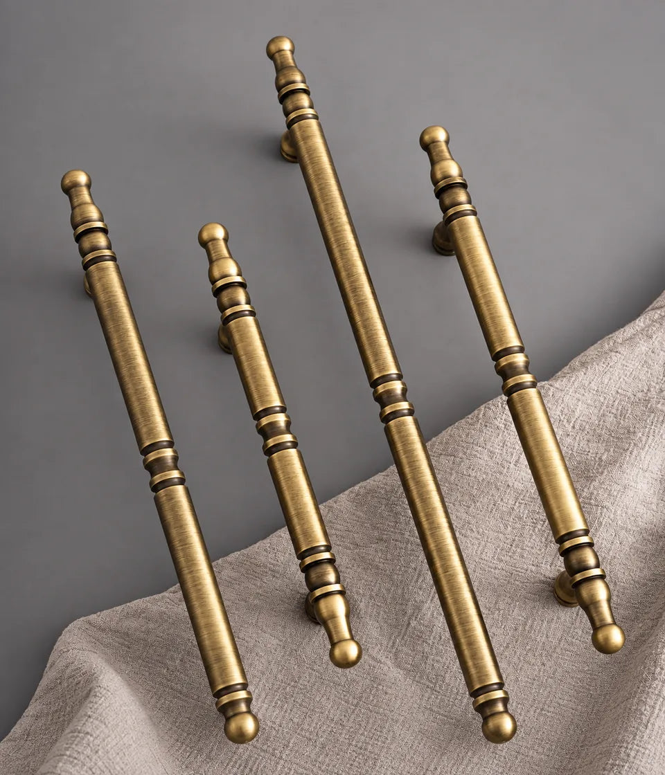 Antique brass spindle cabinet pull finish and decorative end detail