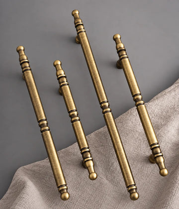 Antique brass spindle cabinet pull finish and decorative end detail