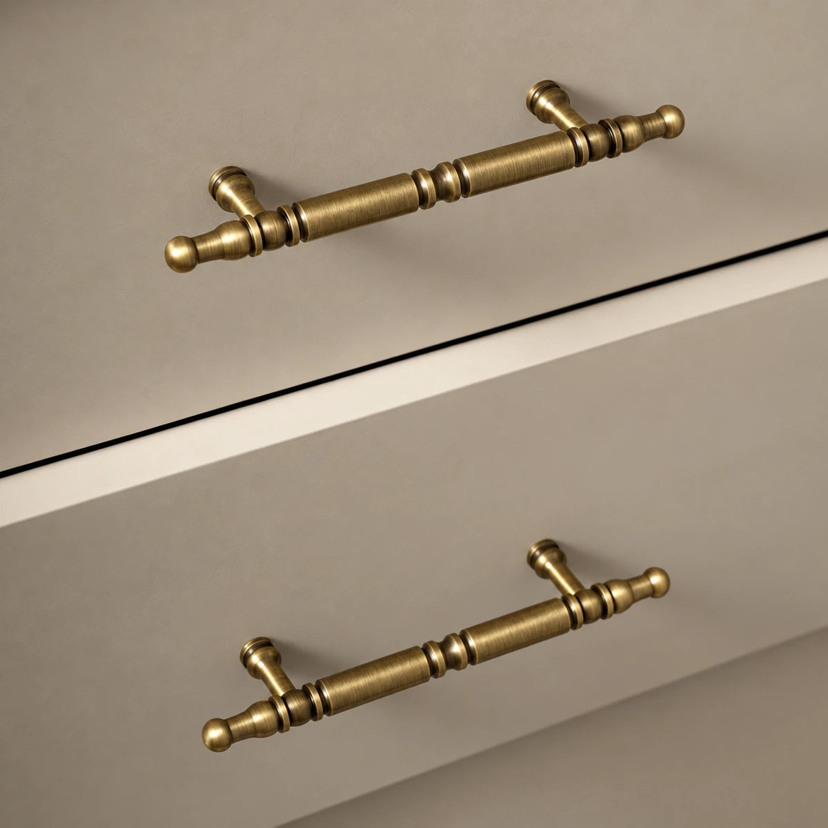 Antique brass spindle cabinet pulls fitted horizontally to drawers