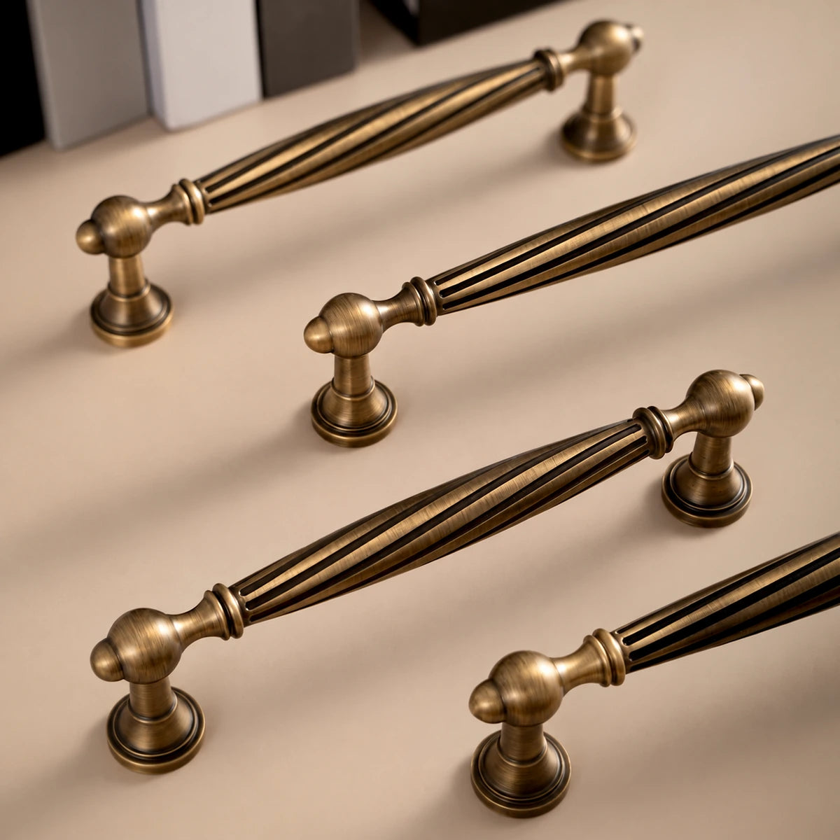 Antique brass spiral pulls arranged on tabletop