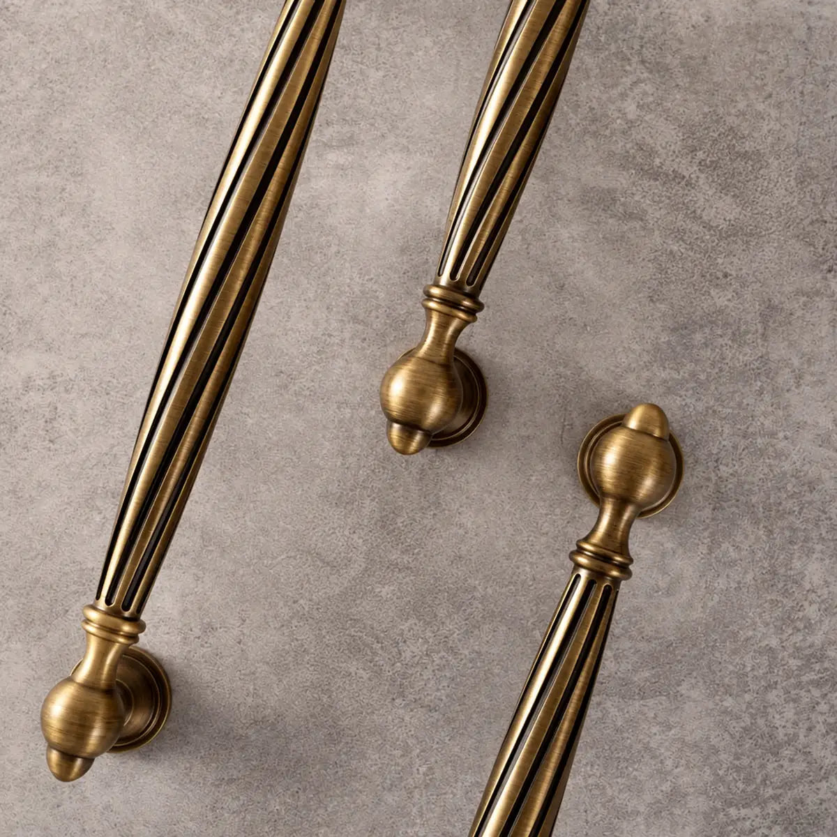 Overhead detail of antique brass spiral cabinet pulls