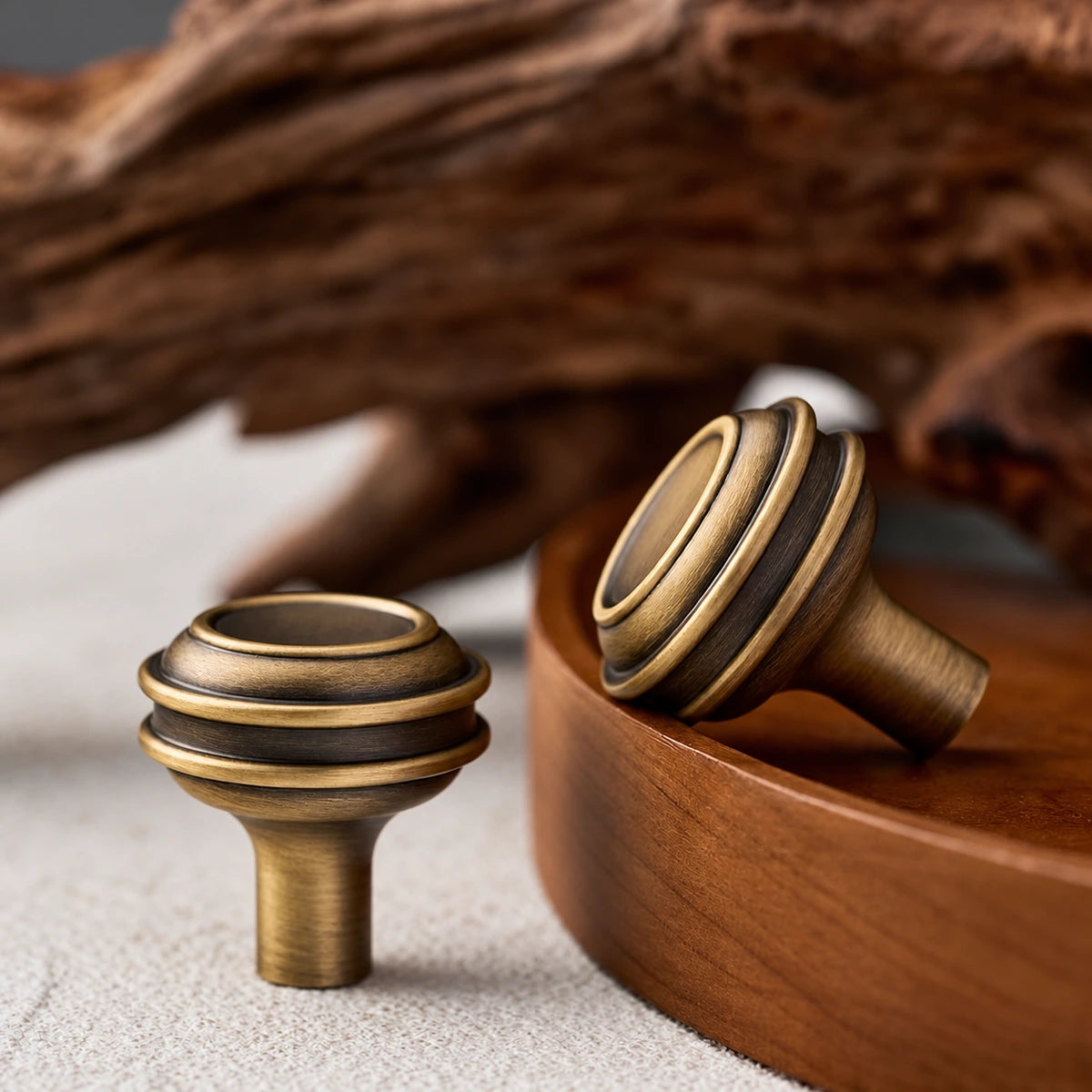 Antique brass stepped knobs showing the face and short stem