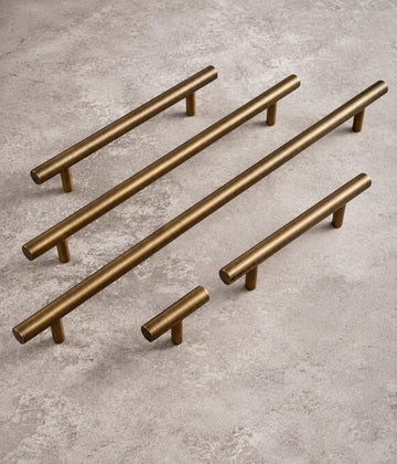 Straight T-bar cabinet pulls and T-knob in antique brushed brass