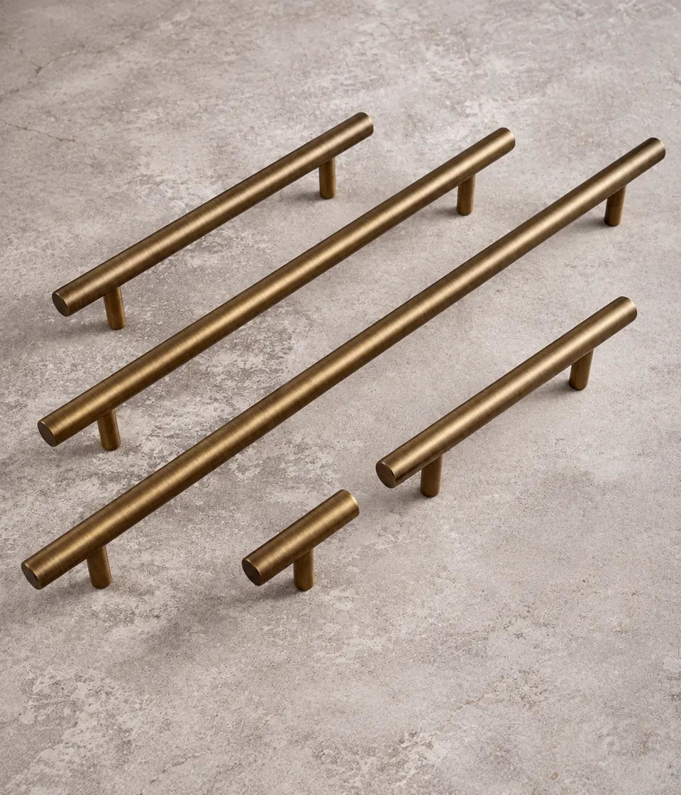 Straight T-bar cabinet pulls and T-knob in antique brushed brass