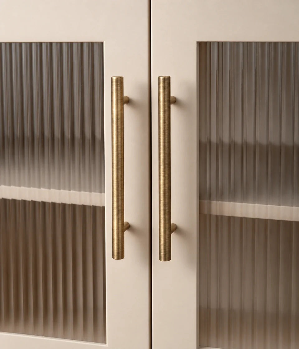 Antique brass T-bar handles installed on cabinetry