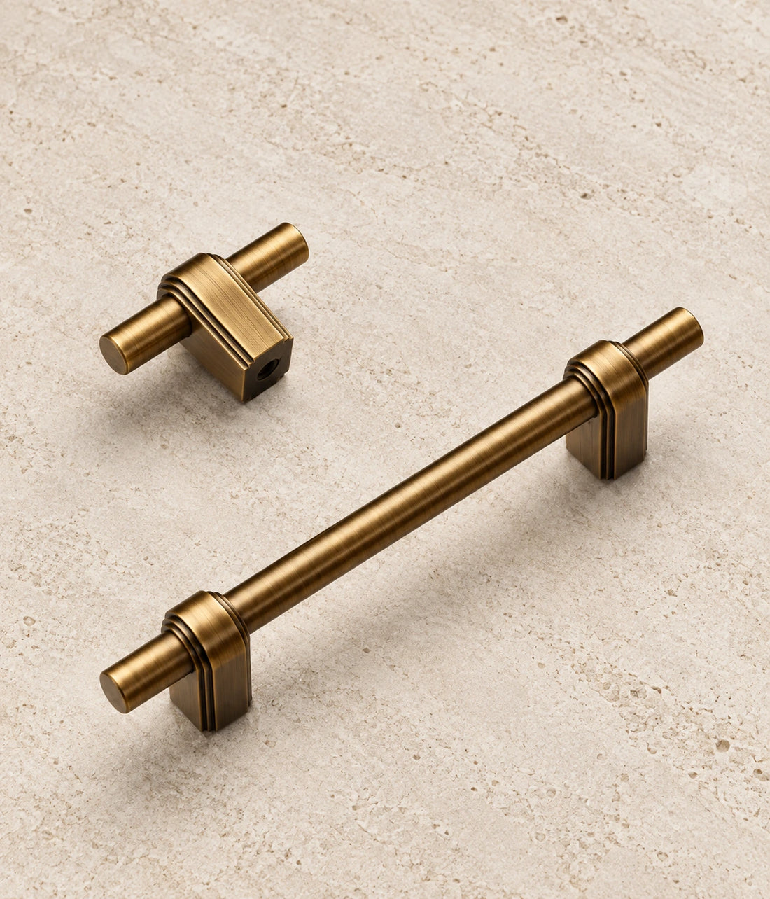 Antique Brass Strap-Post Cabinet Pulls & T-Knob on warm ivory limestone