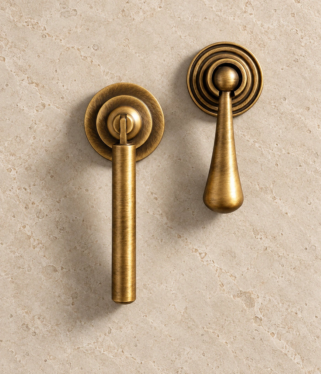 Antique Brass Teardrop & Decorative Pendant Cabinet Pulls on warm limestone