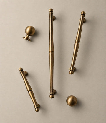 Antique brass turned cabinet pulls with ball ends and matching ball knobs
