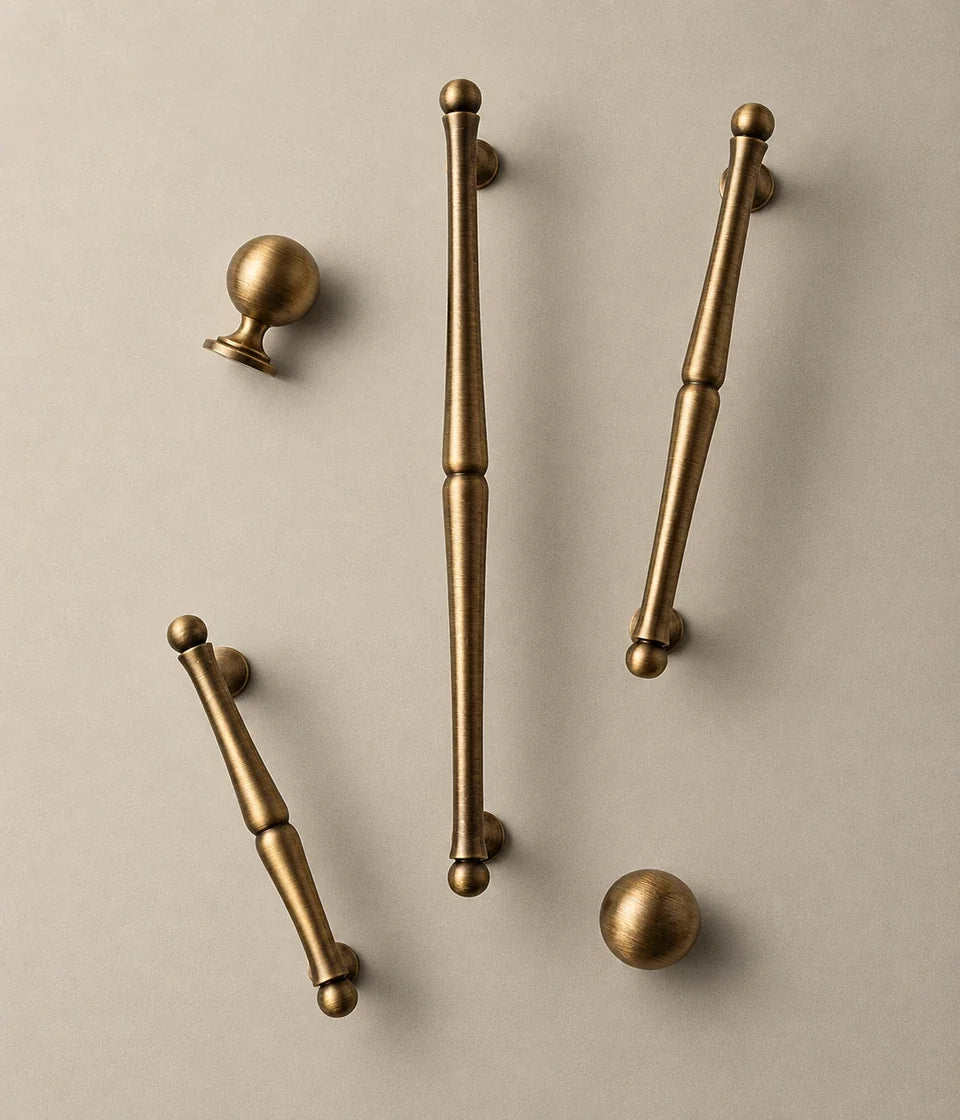 Antique brass turned cabinet pulls with ball ends and matching ball knobs