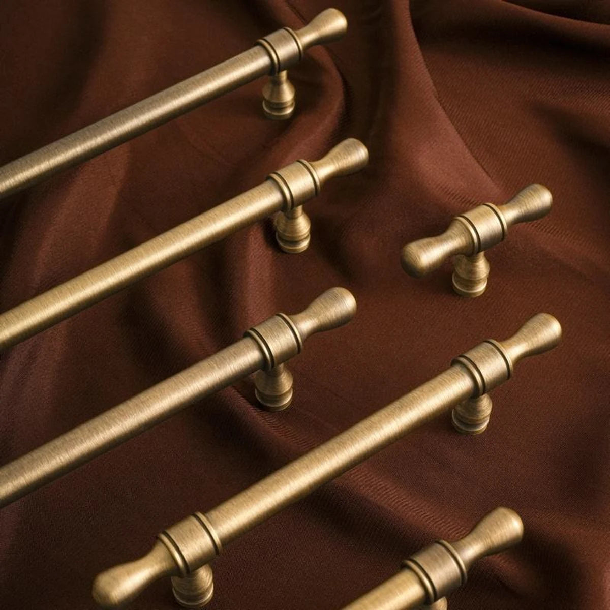 Antique brass turned-tip cabinet pulls and coordinating T-knob