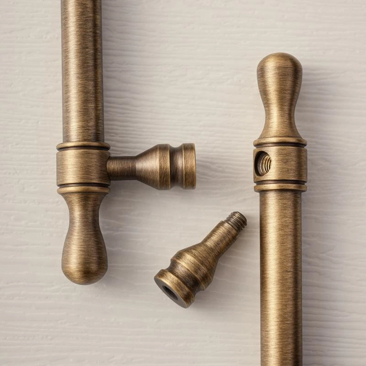 Threaded post detail of antique brass turned-tip cabinet handle