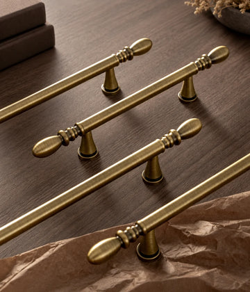 Antique brass water-drop cabinet pull finish and decorative end detail