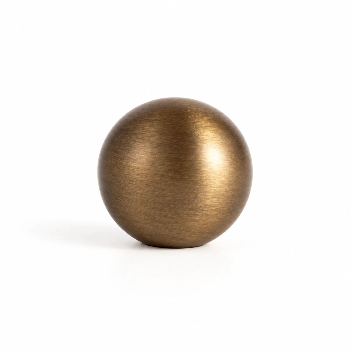 Close-up of the 29 mm stemless antique brass ball cabinet knob