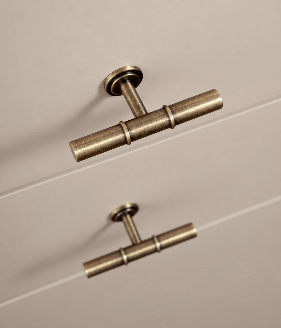 Antique brass double collar T-knobs installed on cabinet fronts