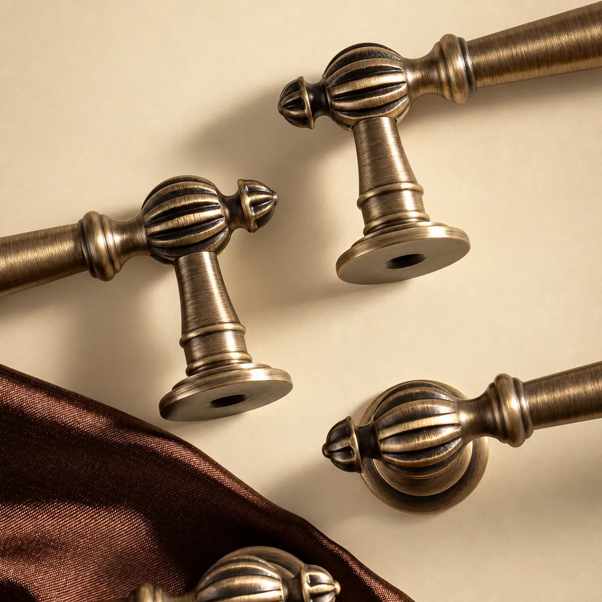 Close-up of fluted brass finials, pointed tips and round mounting bases