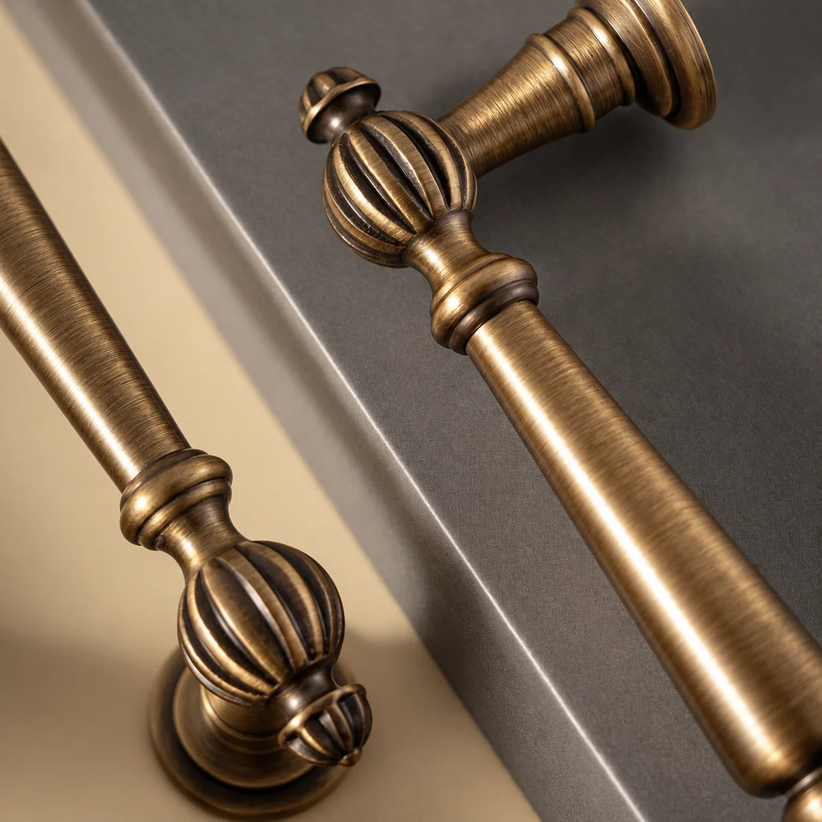 Antique brushed brass finish and fluted ball detail on cabinet pulls