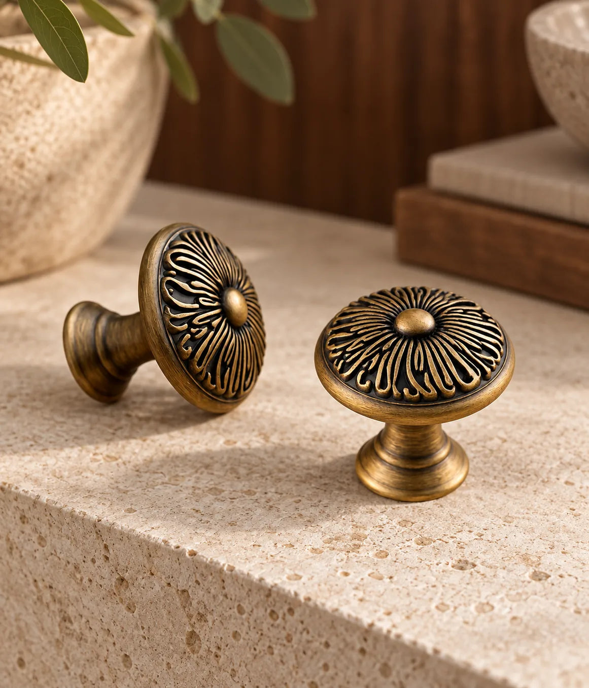 Antique brass floral cabinet knobs styled with limestone and warm walnut