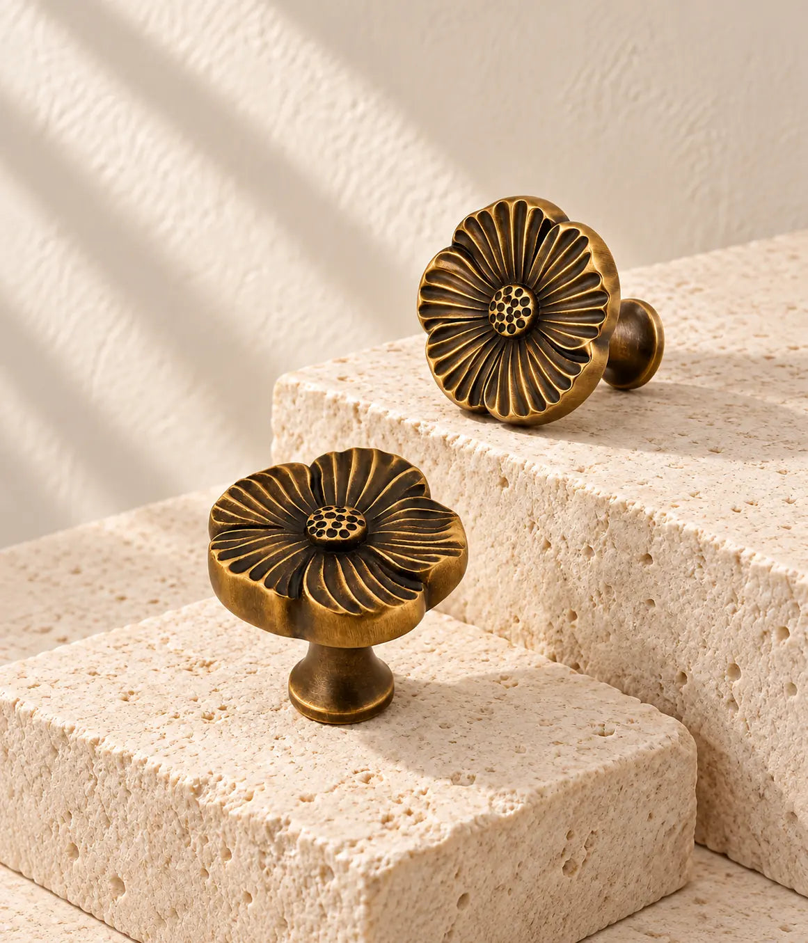 Antique brass grooved flower cabinet knobs on ivory stone blocks