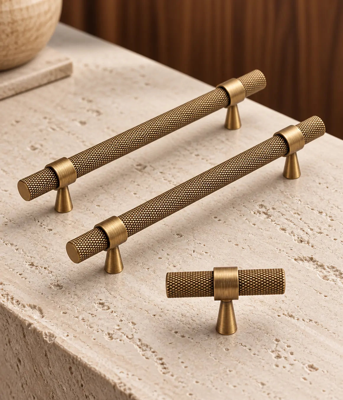 Antique brass knurled cabinet pulls and T-knob styled against warm walnut