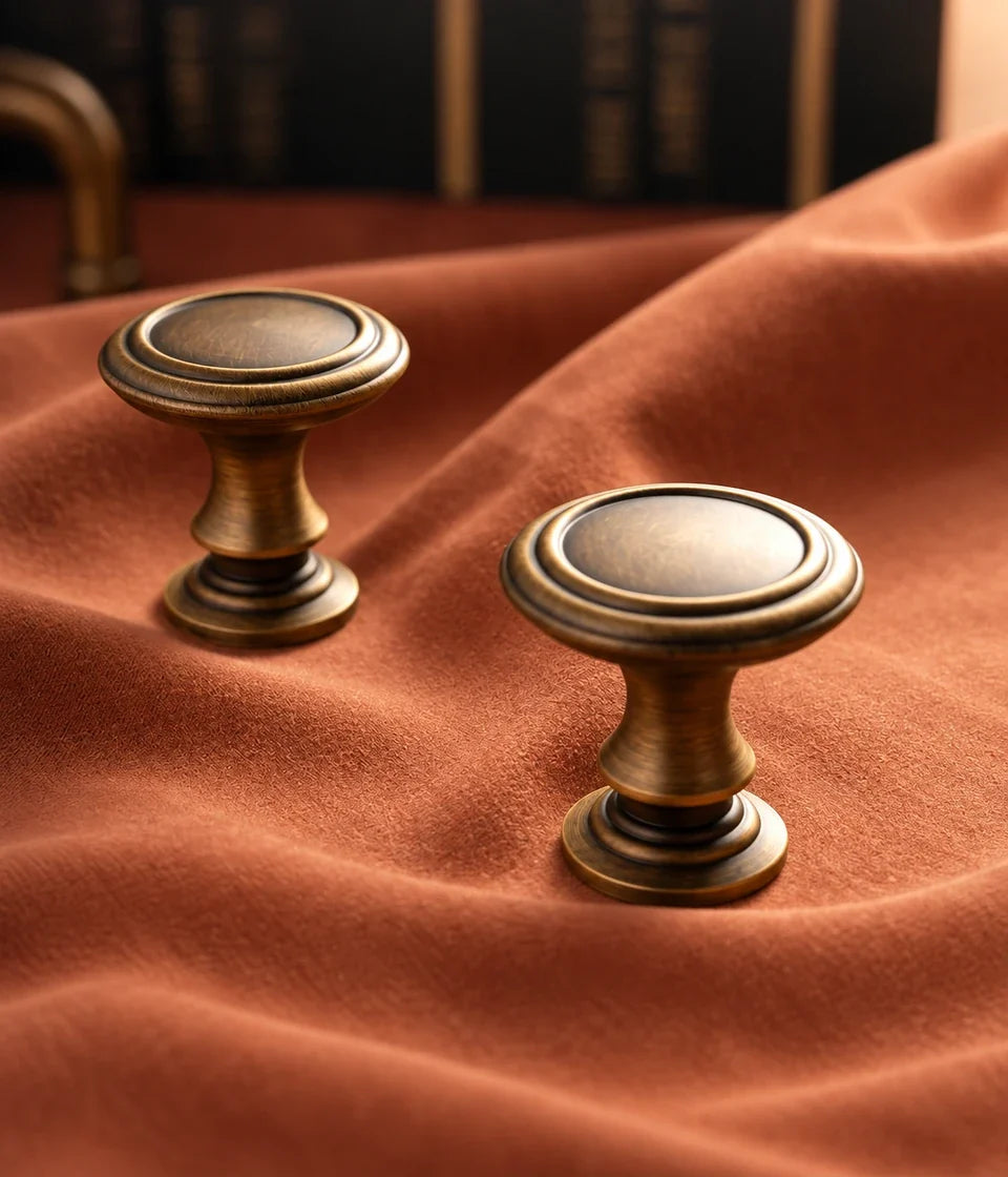 Antique brushed brass round cabinet knobs with collared stems