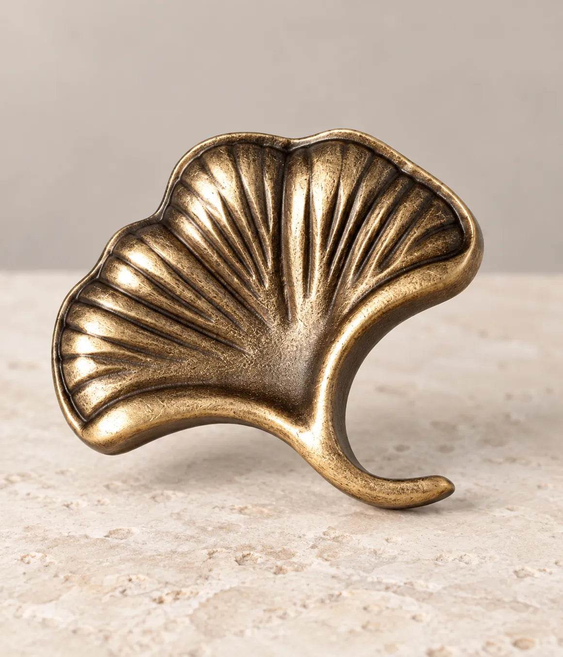 Close-up of sculpted veins on an antique brass ginkgo leaf knob