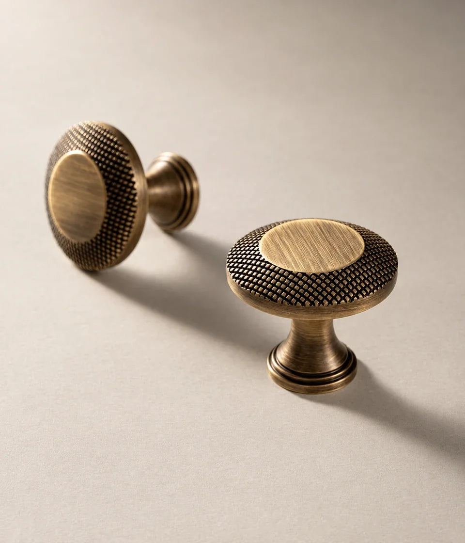 Antique brushed brass cabinet pulls with knurled rims and smooth centers