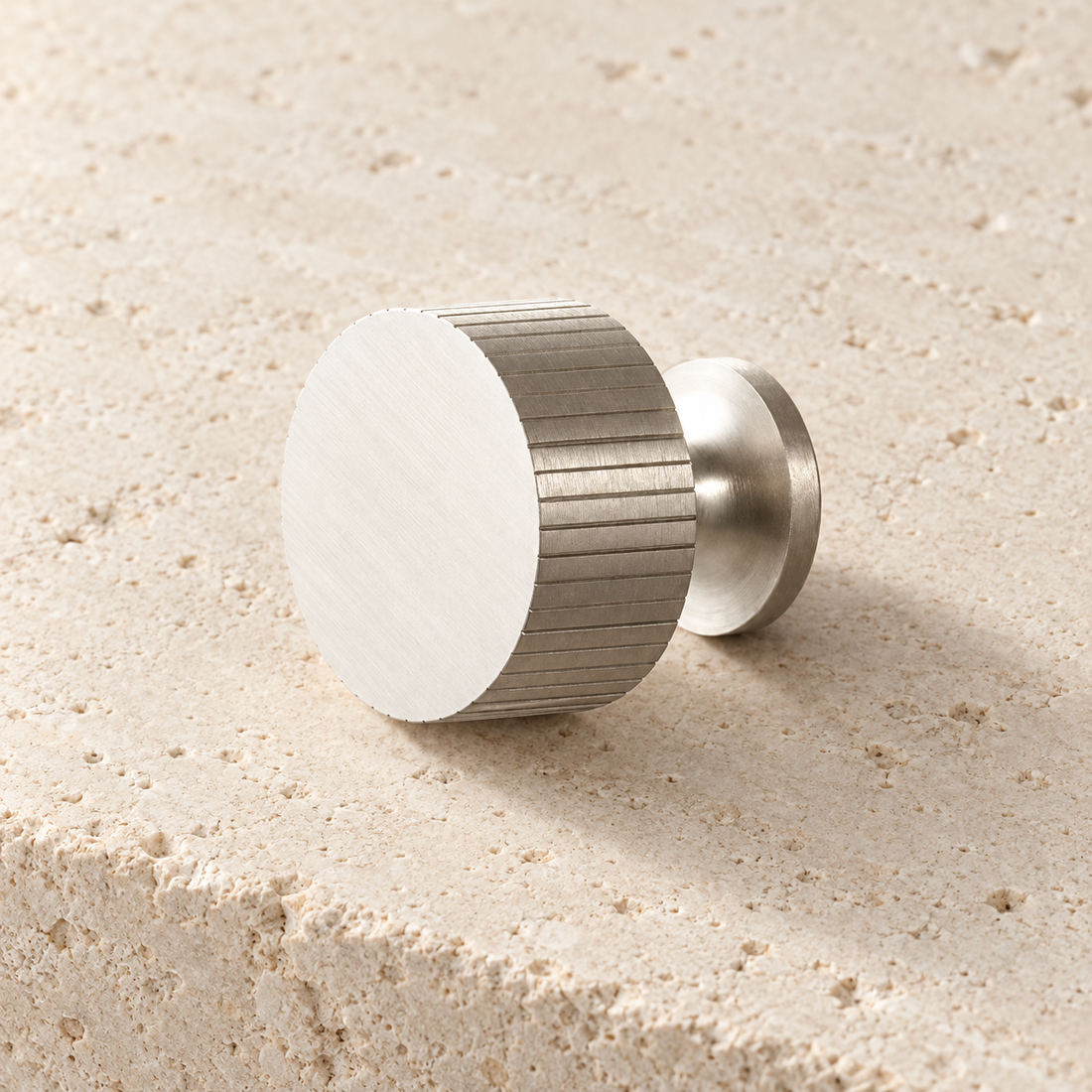 Art Deco Solid Brass Cabinet Knob on pale limestone.