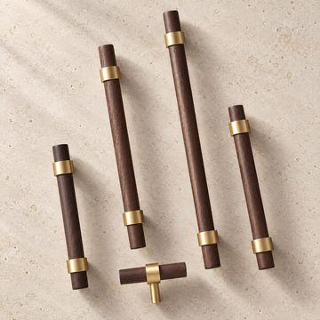Brass & Wood Handle displayed on pale limestone.