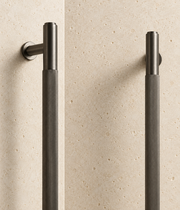 Solid Gunmetal Brass Linear Handle displayed on pale limestone.