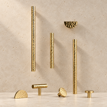 Solid Brass Hammered Handle displayed on pale limestone.