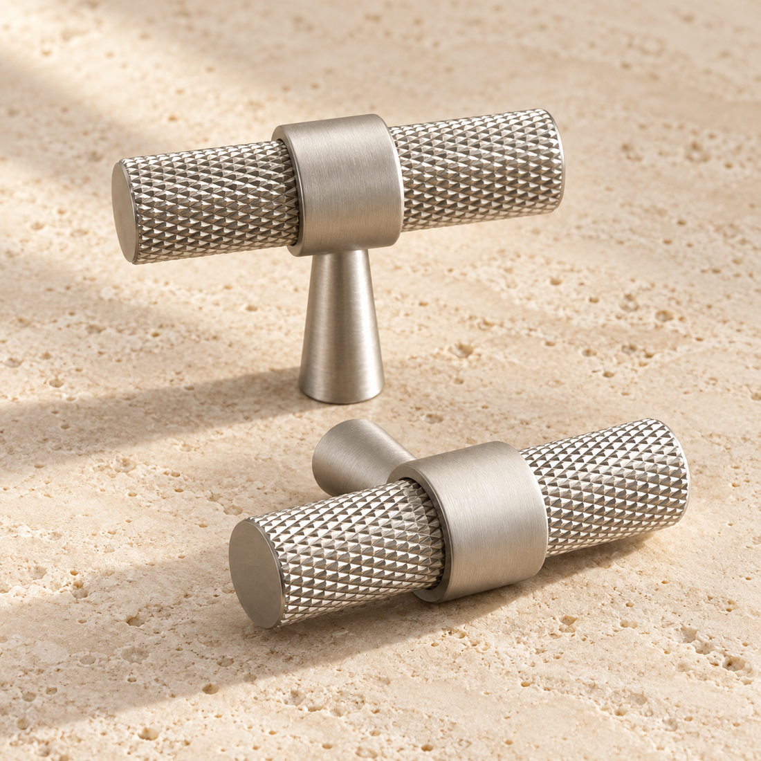 Antique Brass Cabinet Knobs and Door Pulls | Furniture Drawer Handles and T-Bars displayed on pale limestone.