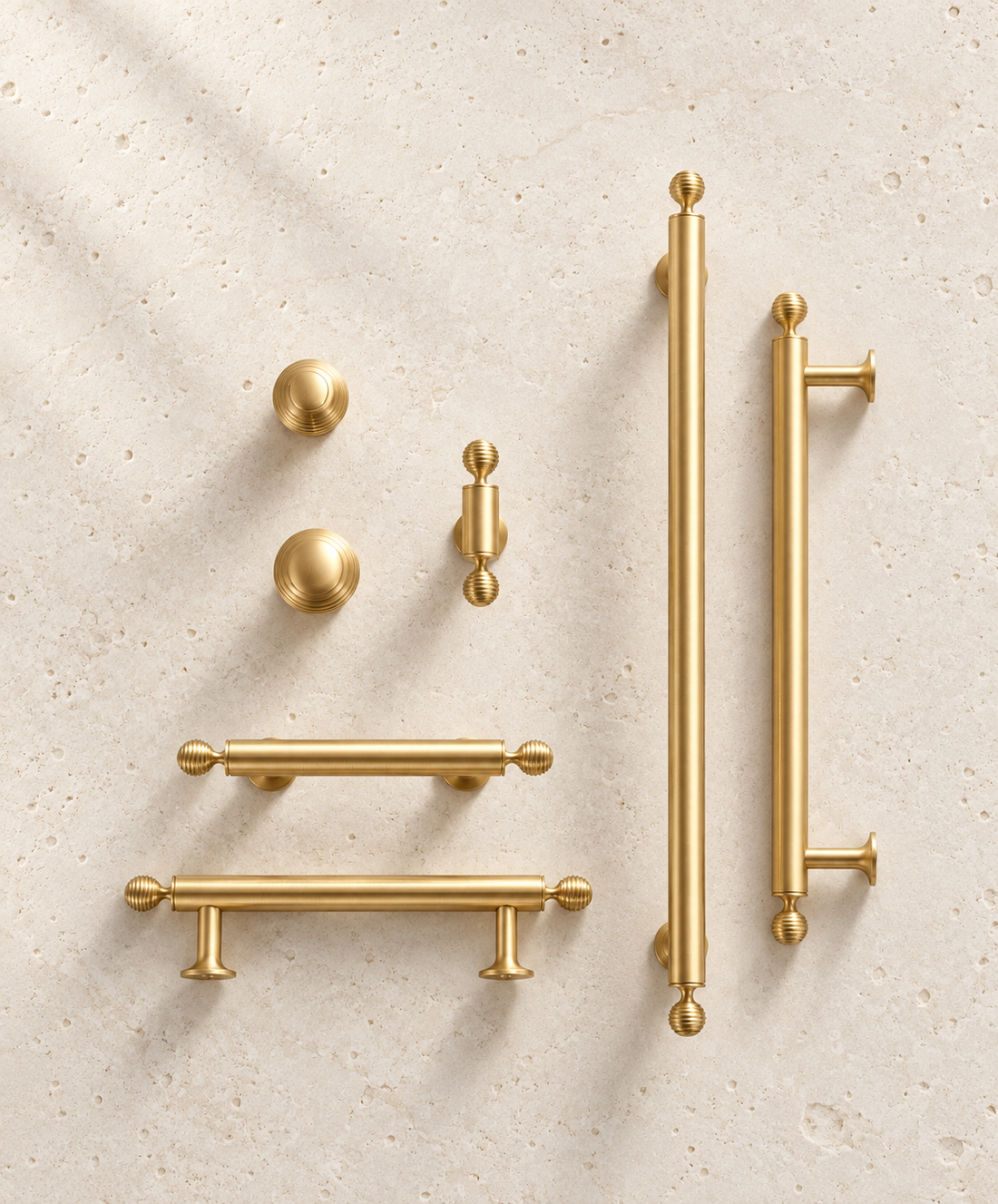 French Luxury Brass Handle displayed on pale limestone.