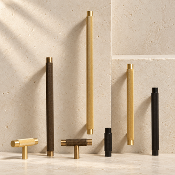 Solid Brass Knurled Handle displayed on pale limestone.