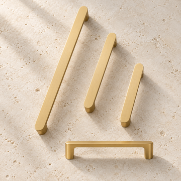 Solid Brass Handle displayed on pale limestone.