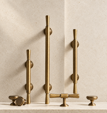 Solid Brass Handle displayed on pale limestone.