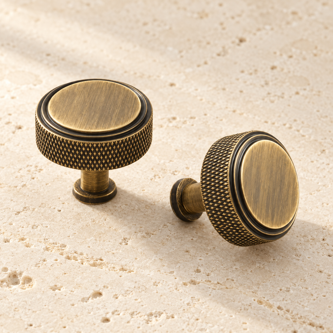 Solid Brass Knurled Cabinet Knob displayed on pale limestone.