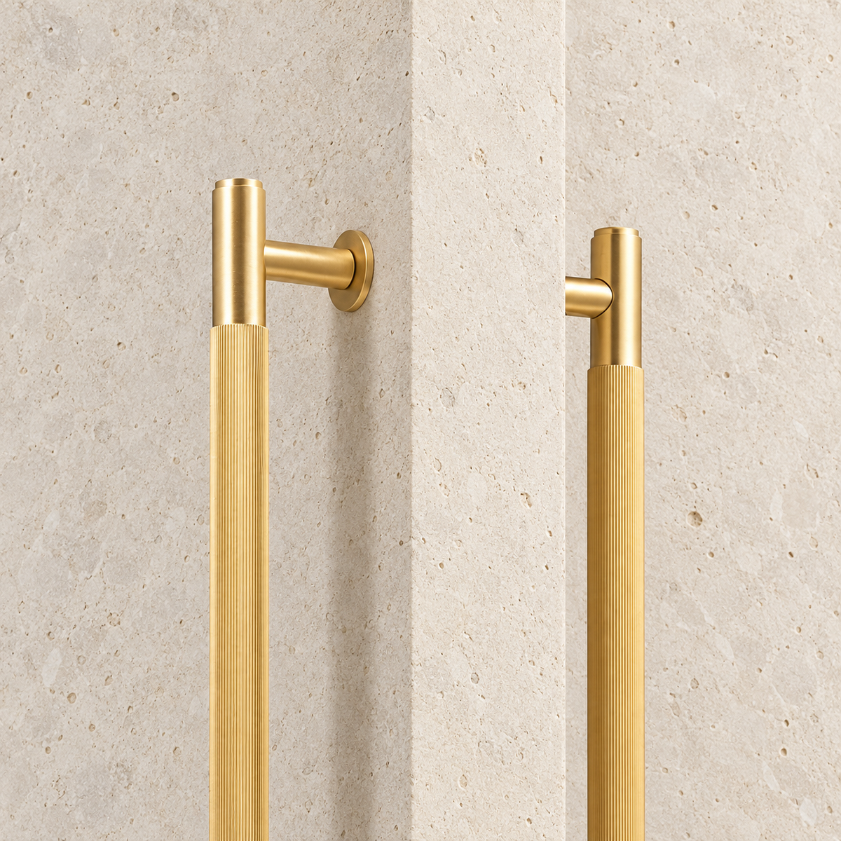 Brass Linear Door Pull Bar displayed on pale limestone.