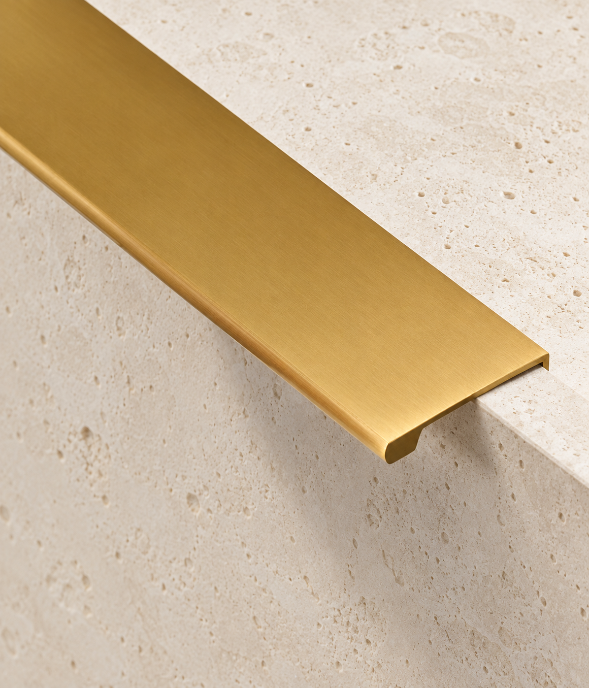 Solid Brass Edge Pull Handle displayed on pale limestone.