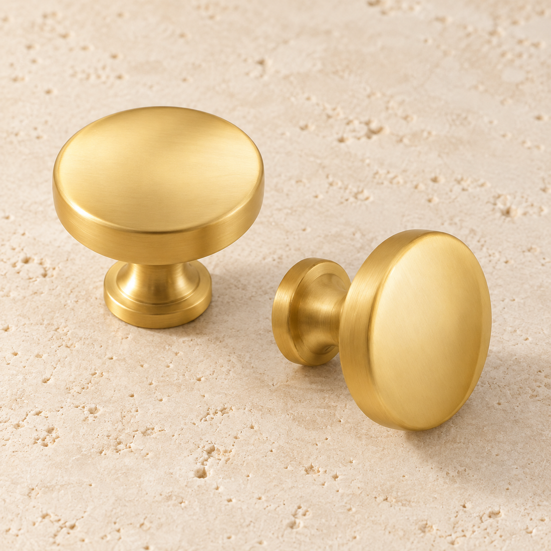 Solid Brass Round Cabinet Knob displayed on pale limestone.