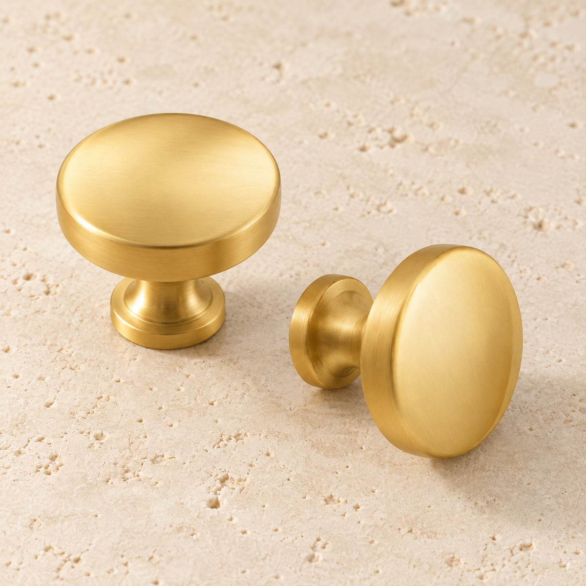 Solid Brass Round Cabinet Knob displayed on pale limestone.