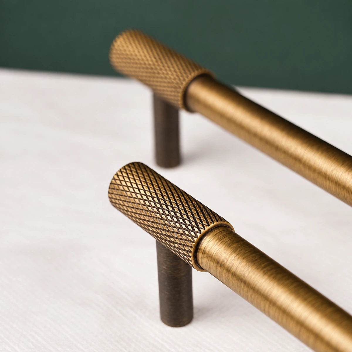 Close-up of antique brass knurled end and smooth cabinet pull grip